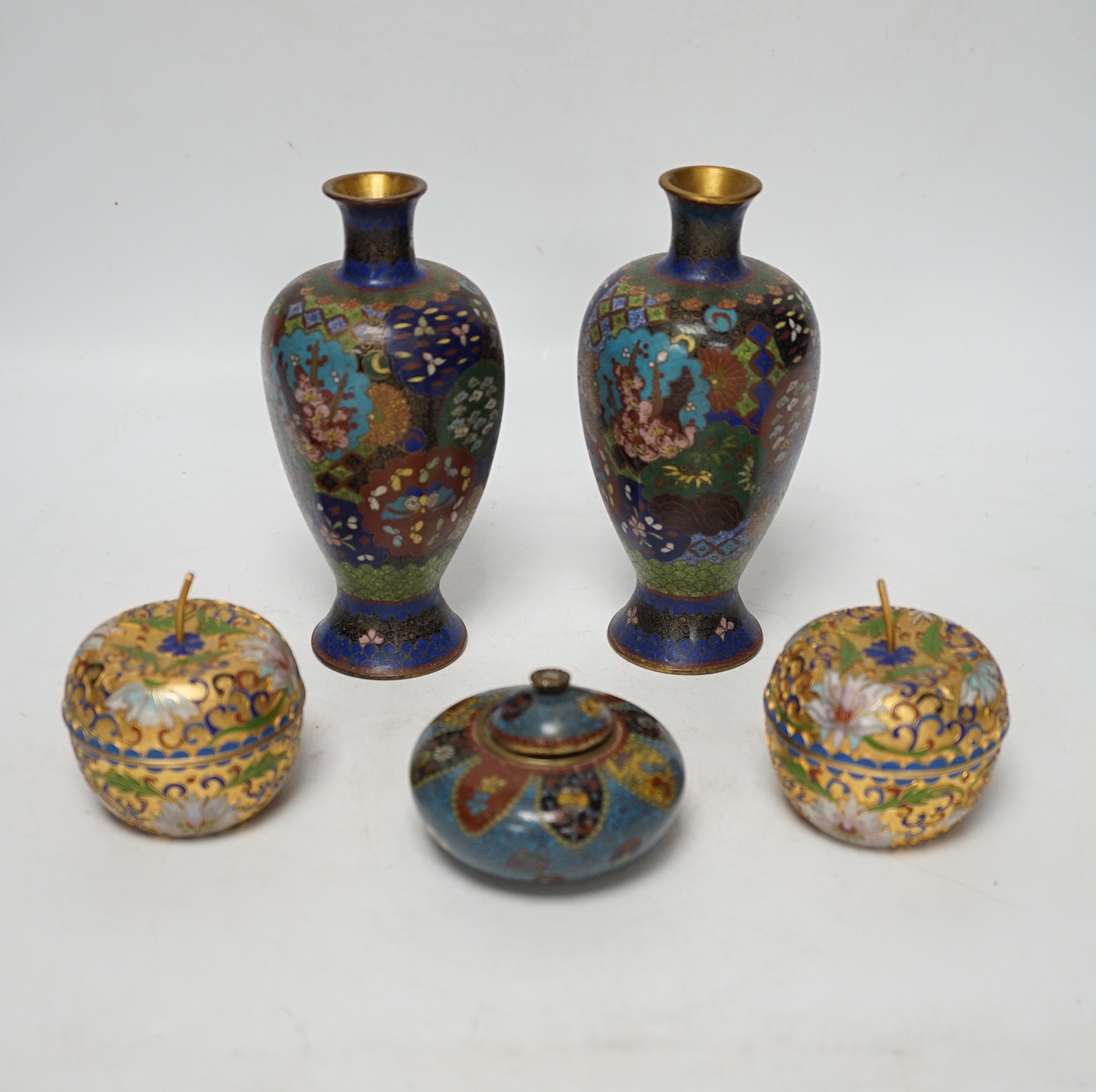 A pair of Chinese cloisonné enamel vases, similar Meiji period Japanese pot and cover and a pair of champleve ‘Apple’ boxes and covers, tallest 15cm